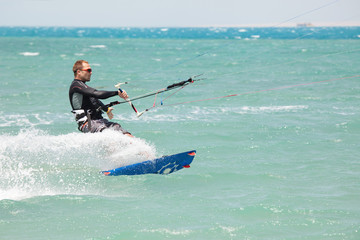 Kiteboarder surfing