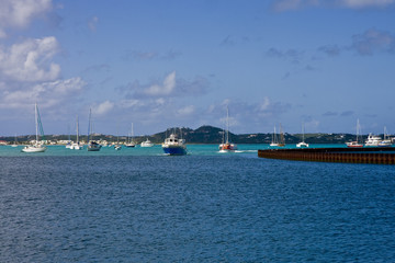 Blue Ferry Past Sailboats