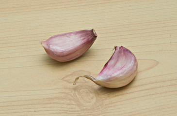 two garlic cloves on desk