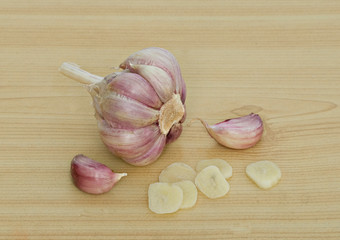 Garlic and cloves on desk