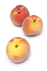 Peaches isolated on a white studio background.