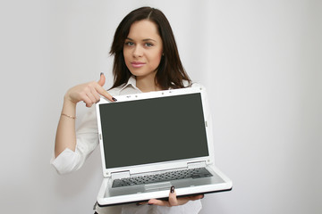 pretty businesswoman holding laptop