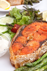 salmon with vegetables, lemon and sauce