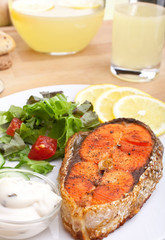 salmon with vegetables, lemon and sauce