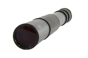 Old black spyglass isolated over white background