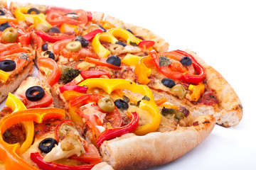 whole vegetable pizza cut into slices