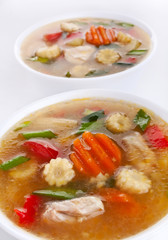 two servings of chicken and vegetable soup