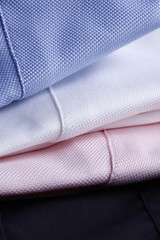 textile background - three business shirts stacked