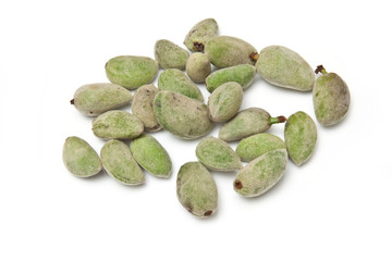 Fresh green almonds isolated on a white studio background.