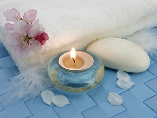 Fototapeta na wymiar Body relax composition with aromatic candles, soap and towel