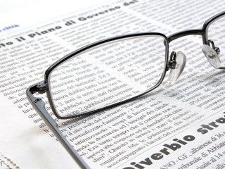 Newspaper with glasses