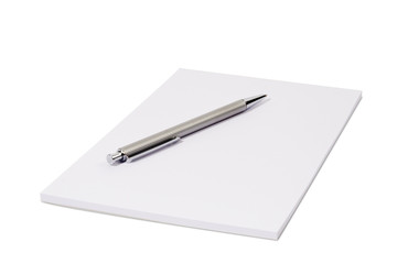 White notepad isolated over white with a ball pen