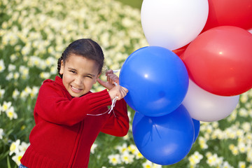 Fototapeta na wymiar Beautiful Little Girl Playing With Balloons