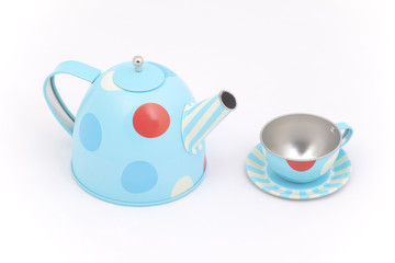 Child's toy teapot and cup