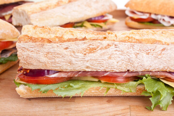 group of sub sandwiches on a table