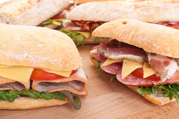 group of stuffed sub sandwiches on a table