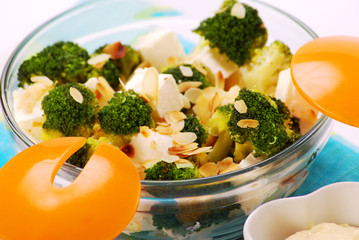 salad with broccoli,feta,almond and garlic dip