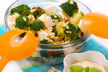 salad with broccoli,feta,almond and garlic dip