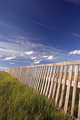 Wooden boundary fence in Southern Alberta, Canada