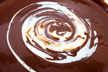 Melted chocolate and cream swirl