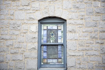 Window on exterior of stone wall