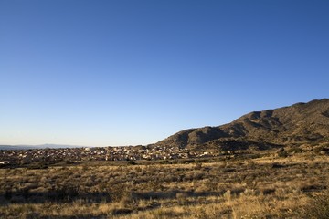 Residential area below a mountain..