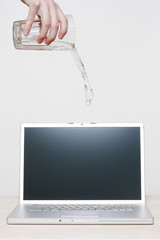 Spilling water on laptop