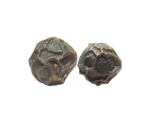 two pepper's grains on white background
