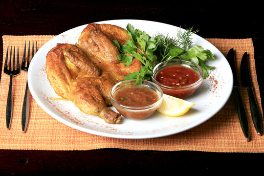 Roasted whole chicken on a plate