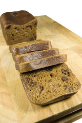 malt loaf on board isolated on white