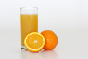 A glass of fresh orange juice on a white background