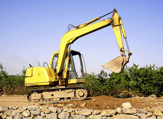 Obraz premium Orange excavator at construction site