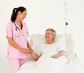 Fototapeta premium Nurse helping a senior patient