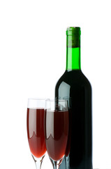 Bottle and wine glass on reflective background