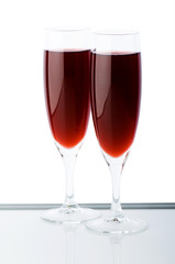 Two wine glasses on the white background