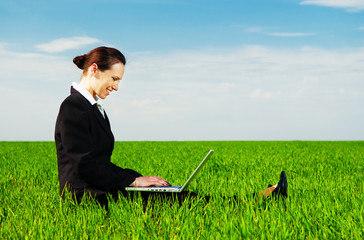 smiley woman resting with laptop