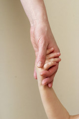 mother and child handshake