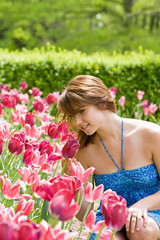 Obraz na płótnie Canvas Girl With Pink Tulips