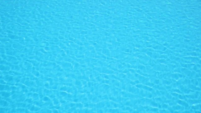 Pattern of small ripples in the blue water pool