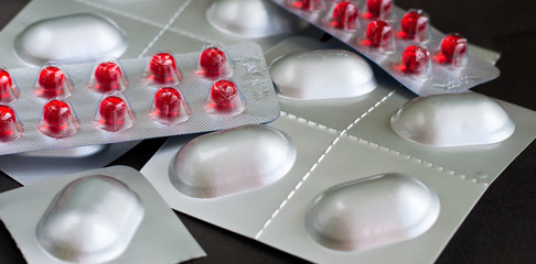 Pills and blister packs of tablets