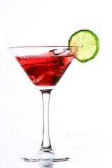 red cocktail with lime on white