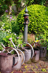Still life in a german garden, old watering cans