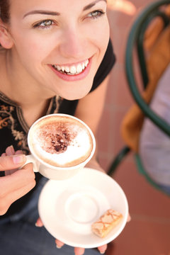 happy young woman with cup of coffe