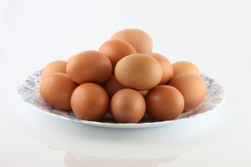 Eggs in a bowl on a white background