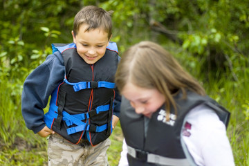 Happy boy in lifesaving jacket