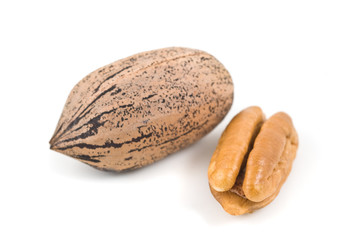 Pecan nuts on white background, close up.