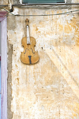 Violin on a house wall in an old Tel Aviv