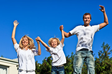 Family jumping in the air