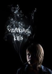 young women smokes in the smoke appears 