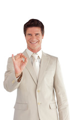 Business man showing positive sign